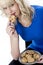 Young Woman Eating a Chocolate Chip Cookie Biscuit