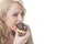 Young Woman Eating Chocolate Iced Donut