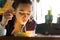 Young Woman Eating with Chopsticks