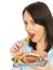 Young Woman Eating Donner Kebab with Salad