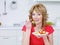 Young woman eating salad in the kitchen