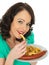 Young Woman Eating Saveloy Sausage and Chips