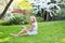 Young woman eating sushi in Japanese park