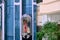 Young woman in the elevator lobby of the arab hotel. Palm tree and balconies in a hotel building in Tunisia, middle East