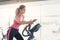 Young woman on elliptical trainer