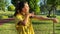 Young woman engages in thorough warm-up routine in public park