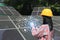 Young woman engineer checking solar panel with hologram at solar power plant