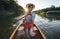 Young woman enjoy canoeing on the sunset lake