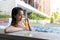 Young Woman enjoy drink in jacuzzi spa