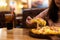 Young woman enjoy eating Hawaiian pizza with soft drink in restaurant for dinner.