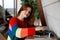 Young woman enjoying analog music in home interior. Listening to vinyl records