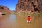 Young woman enjoying the beach above Hance Rapids in the Grand Canyon.