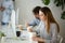 Young woman enjoying chinese food box during office lunch break