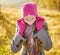 Young woman enjoying fall season. Autumn outdoor portrait