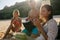 Young woman enjoying holidays with her friends on the beach