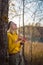 Young woman enjoying life in nature eats an apple and laughs. lifestyle photo