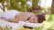 Young woman enjoying an outdoor spa treatment