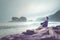 Young woman enjoying a Papuma beach view