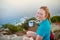 Young woman enjoying some coffee on a morning hike