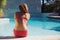 Young woman enjoying summer at the swimming pool