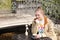 Young woman enjoying tasty coffee at table