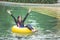 Young woman enjoying tubing at lazy river pool