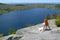 Young woman enjoying the view over lake