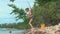 Young woman entering Lake Baikal