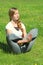 Young woman of European appearance does yoga in summer nature