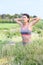 Young woman excercising outdoors in the fields