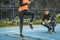 Young Woman Exercise using Agility Ladder, working with Fitness Coach