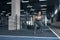 Young woman exercises in gym healthy lifestyle holding barbell close-up