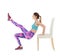 Young woman exercising with chair on white background