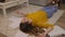 Young woman exhausted from work lying on the floor