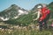 Young Woman explorer hiking at mountains