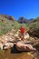 Young woman explores Hance Creek in the Grand Canyon.