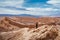 Young Woman Exploring the Moon Valley in the Atacama Desert, Chile, South America