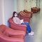 A young woman in a face mask holds a sheet with a doctor appointment