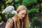 Young woman feeding ibes in the park. Little Egret Cattle egret Bubulcus ibis Waters Edge