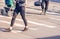 Young woman feet, crossing an urban street