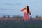 Young woman in the field of blossoming lavender