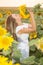 Young woman in a field of sunflowers. sunset light in the field of sunflowers