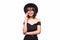 Young woman in fluppy black hat and black clothes talk on phone on white background