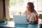 A young woman is focused on a work in the office