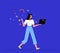 Young woman freelancer walks and holds a laptop in her hands. Concept of remote work, training, online shopping