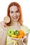 Young woman with fruit on a plate and loaves