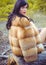 Young woman in fur coat, lifestyle