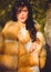 Young woman in fur coat, lifestyle