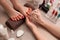 Young woman getting professional pedicure in beauty salon