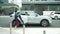 Young woman is getting on to a car in Shenzhen city, China